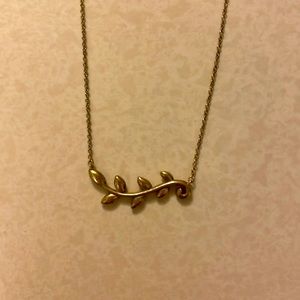 This is an olive branch necklace in a bronze color.